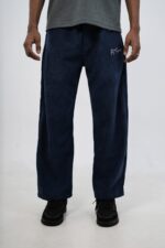Close-up of premium corduroy fabric on baggy corduroy trouser showing its soft textured finish